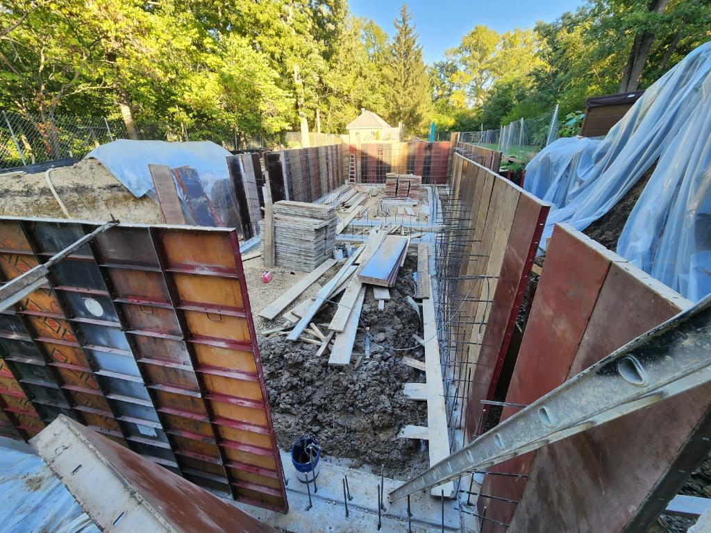 Deep foundation formwork trench with rebar at a home addition