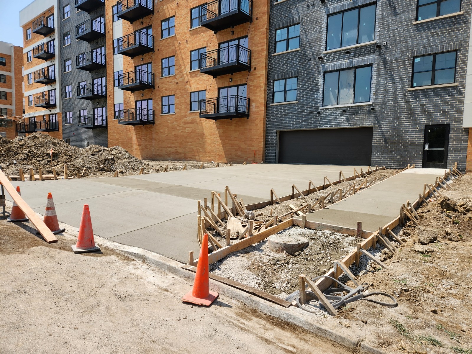 Fresh concrete pour at a large multi-family apartment building